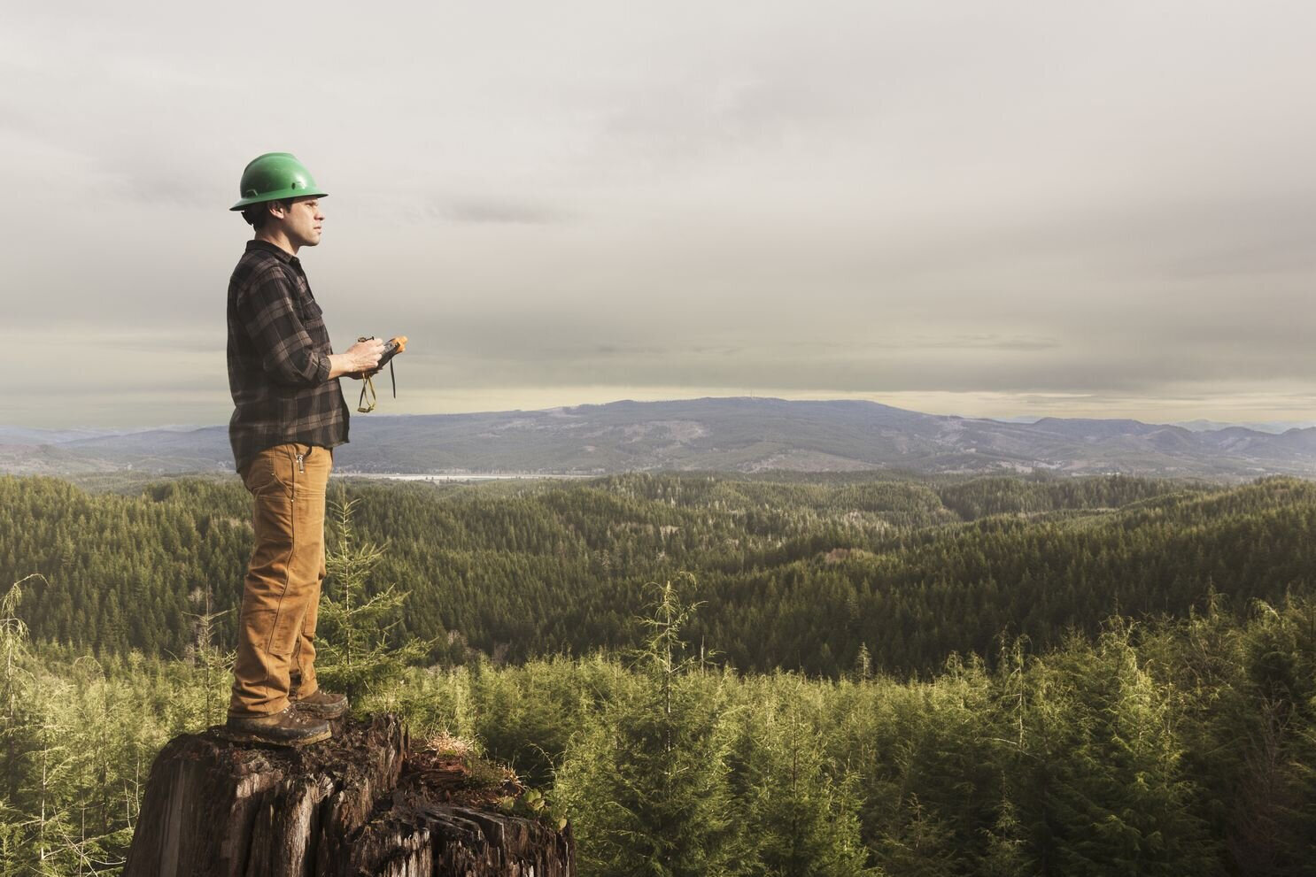  Forester Kyle Smith looks over the Ellsworth Creek Preserve, adjacent to the Willapa National Wildlife Refuge in Southwest Washington. These conservation lands support local jobs and millions of dollars in local forestry and construction contracts. 