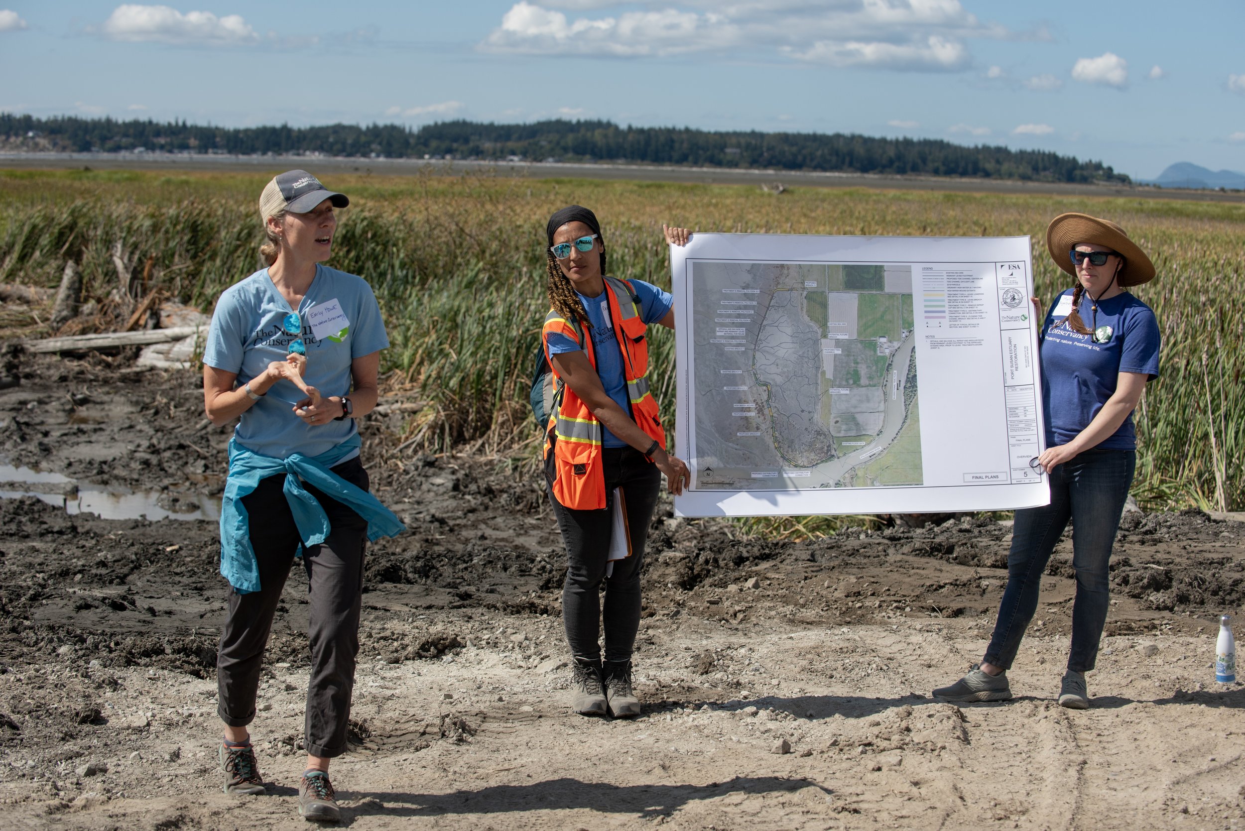  TNC staff members--Emily Howe, Randi Shaw, and Molly Bogeberg--outline the 2012 restoration of Port Susan Bay, what we learned and how we’re approaching restoration today. © Hannah Letinich/TNC 