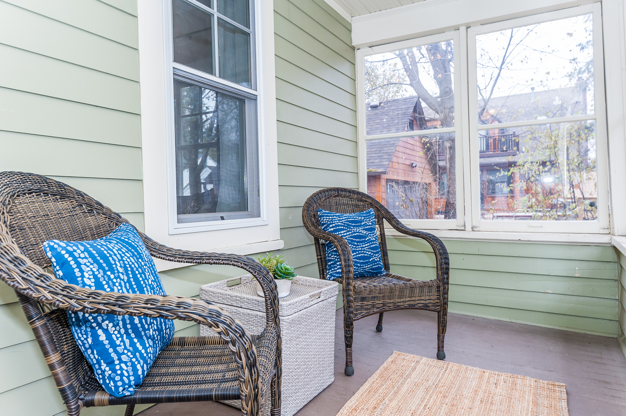 Fantastic enclosed front porch perfect for morning coffee or evening drinks