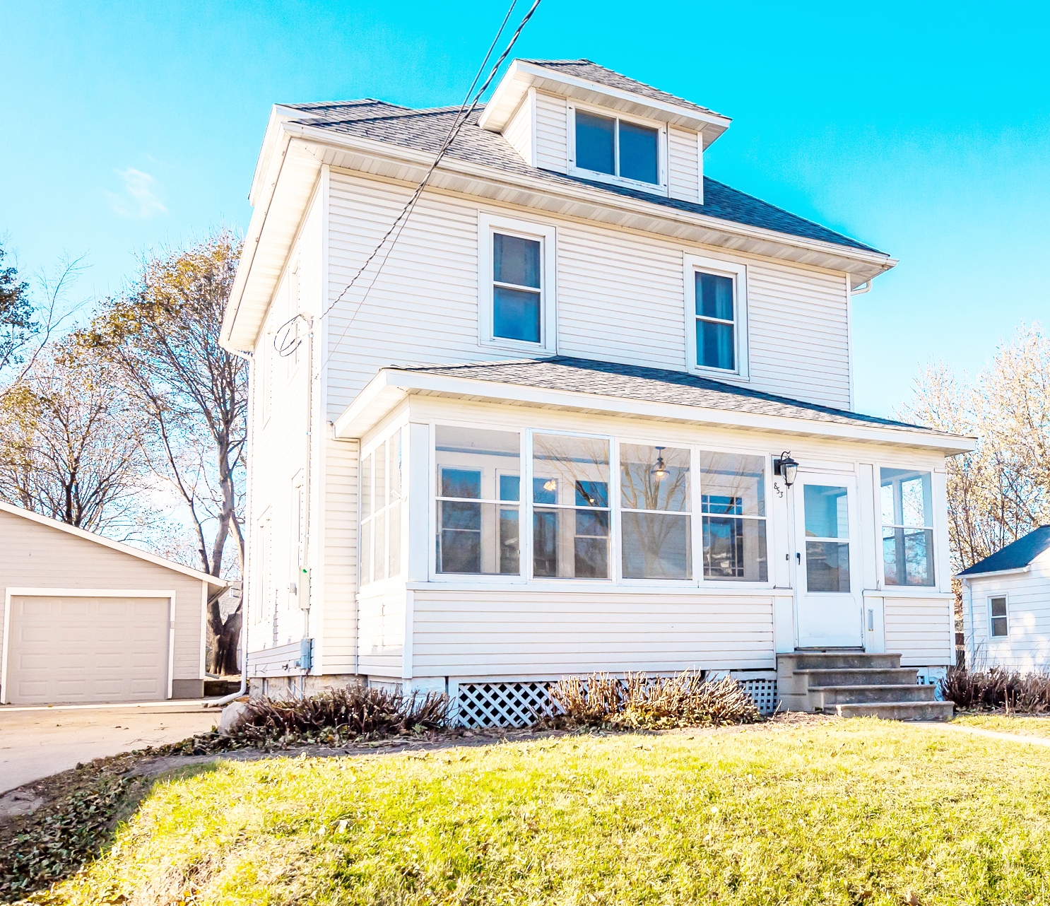 Newly renovated charming home with detached garage, enclosed porch and so much more!