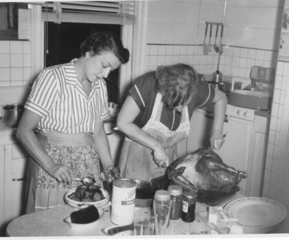 My great-aunt Ada and my grandmother, preparing the feast, 1952.