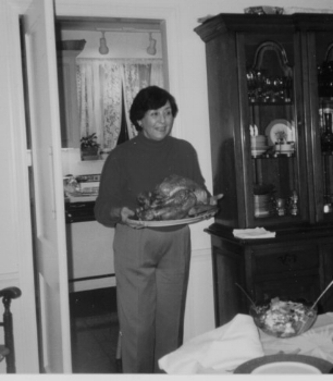 My mother-in-law serving the feast, circa 2000.