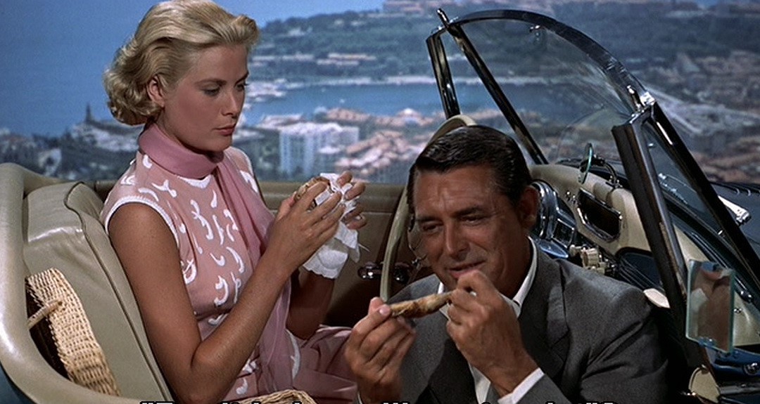 The screen’s hottest picnic: Francie Stevens (Kelly) and John Robie, “The Cat” (Grant) in her Sunbeam-Talbot Alpine Sports Mk I roadster. To Catch A Thief (1955)