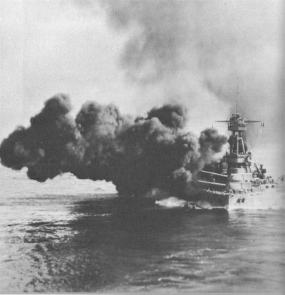 USS Texas fires a salvo of its 14-inch guns.