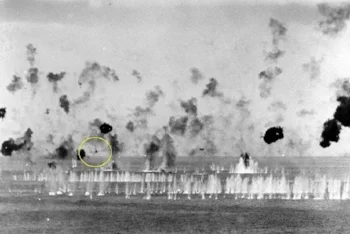 The anti-aircraft fire whitens the water ahead of an incoming kamikaze. Jack writes, “His pendulum-like sway makes him a tough target. Closer and closer he comes…they always look closer. Just when it seems he will prevail, one wing shears off, then the other, he bursts into flames and hits the water in a tumbling splash. There is wild cheering.”