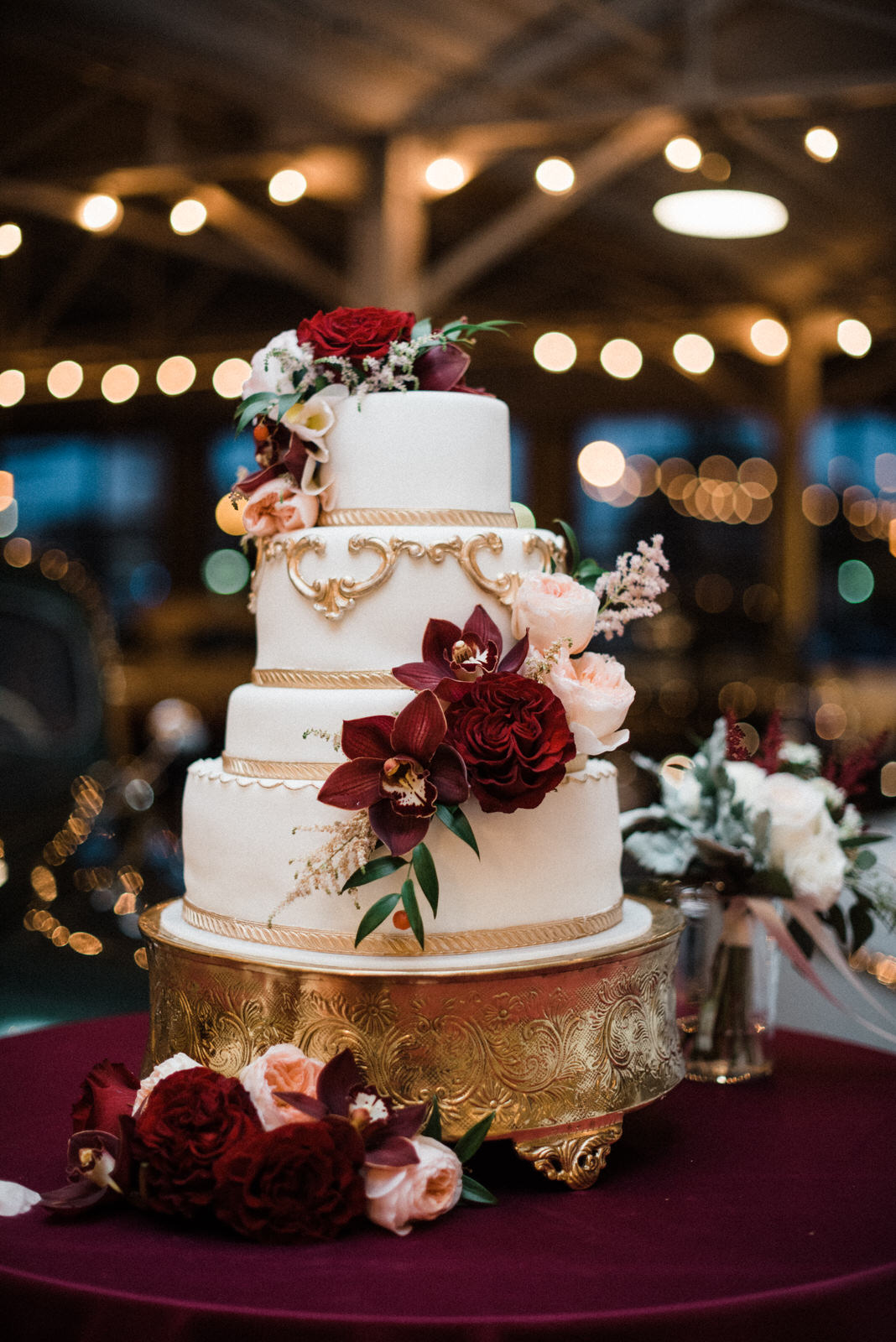  White and gold wedding cake at Americas Packard Museum wedding 
