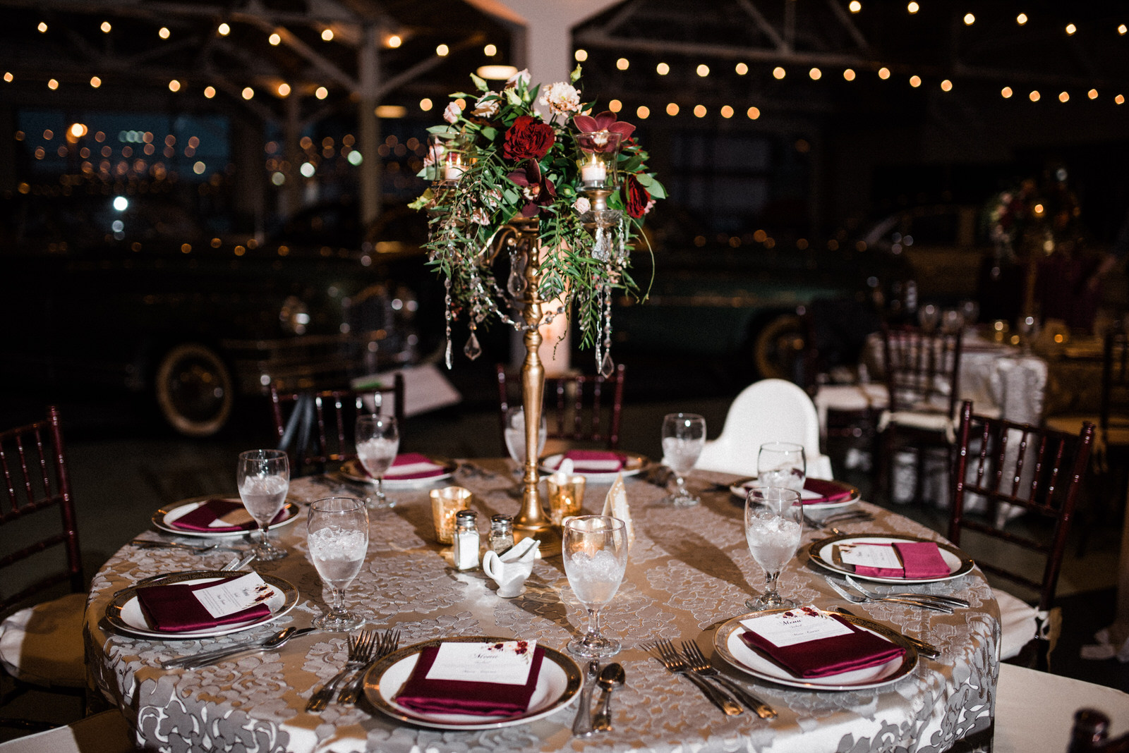  tall Burgundy and greenery centerpiec at Americas Packard Museum wedding 