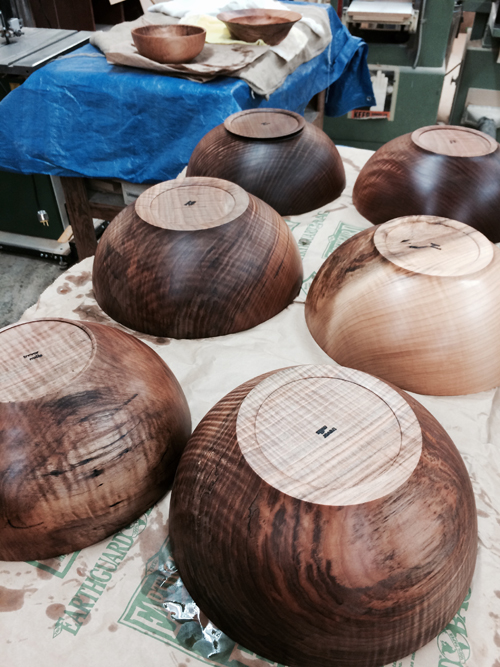 Sanded bowls are signed with Trevor's stamp and finished with a simple, food-safe blend of walnut oil and beeswax which brings out the wood's natural grain, protects the wood and is easy to maintain.