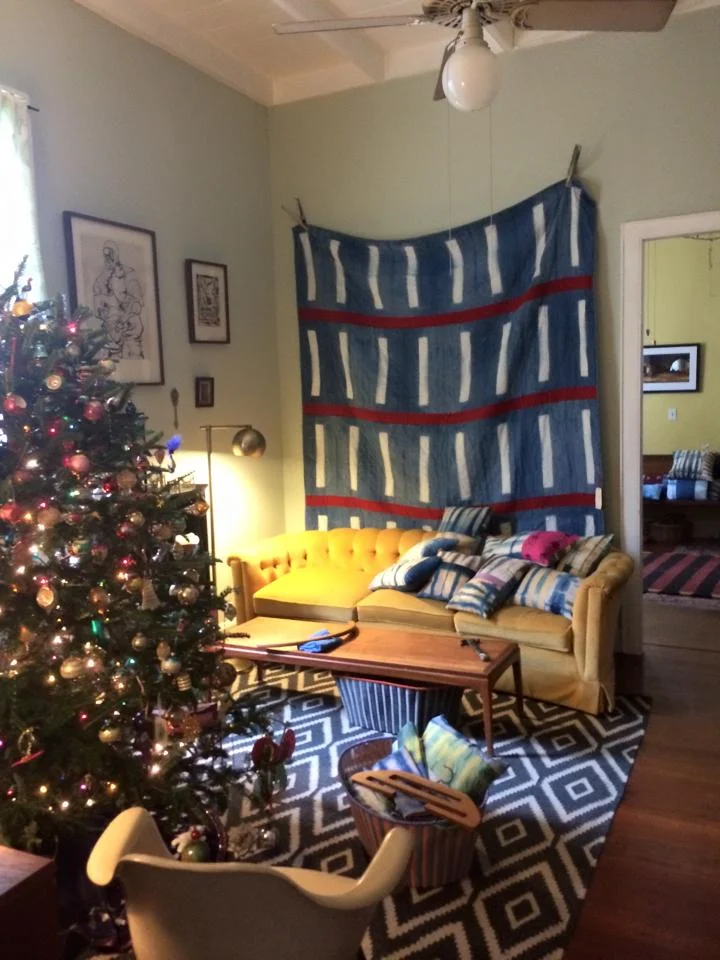 Quilts and pillows and scarves for sale at the Crosby Schoolhouse's sale in New Orleans
