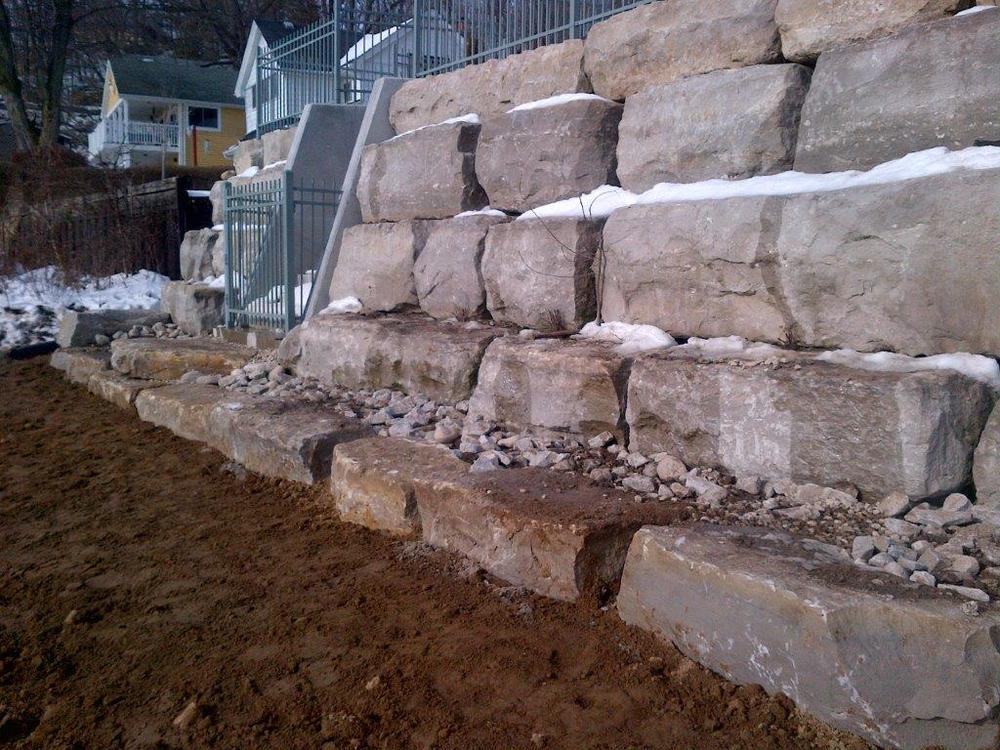 Armour Stone Blue Con Construction - Armour Stone Retaining Wall Design