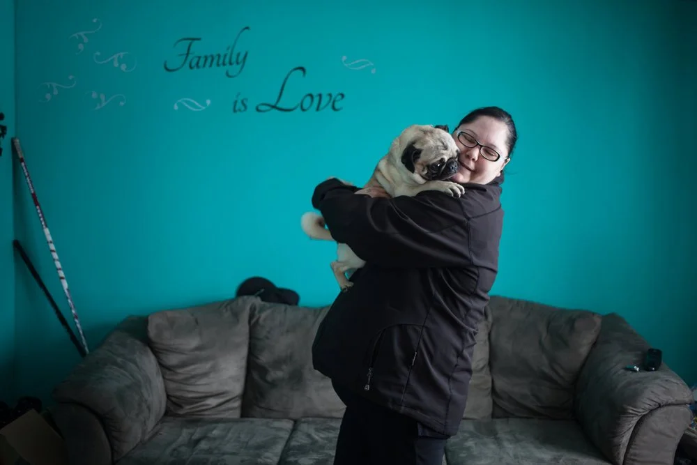  Moment of tendress between Francesca and her dog, Schefferville, 2018  