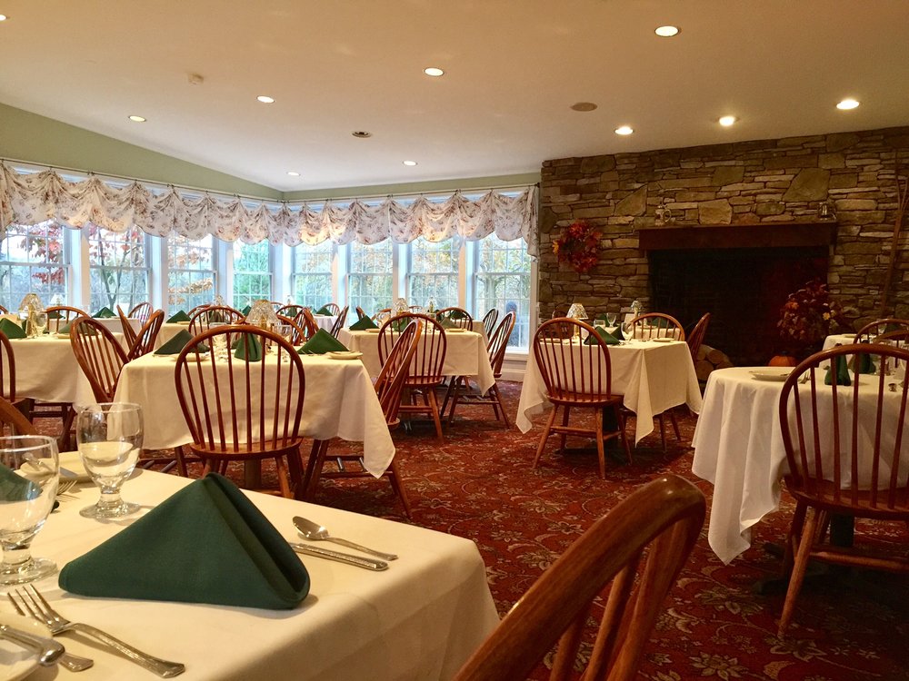 main dining room with meadow and fireplace views.jpg