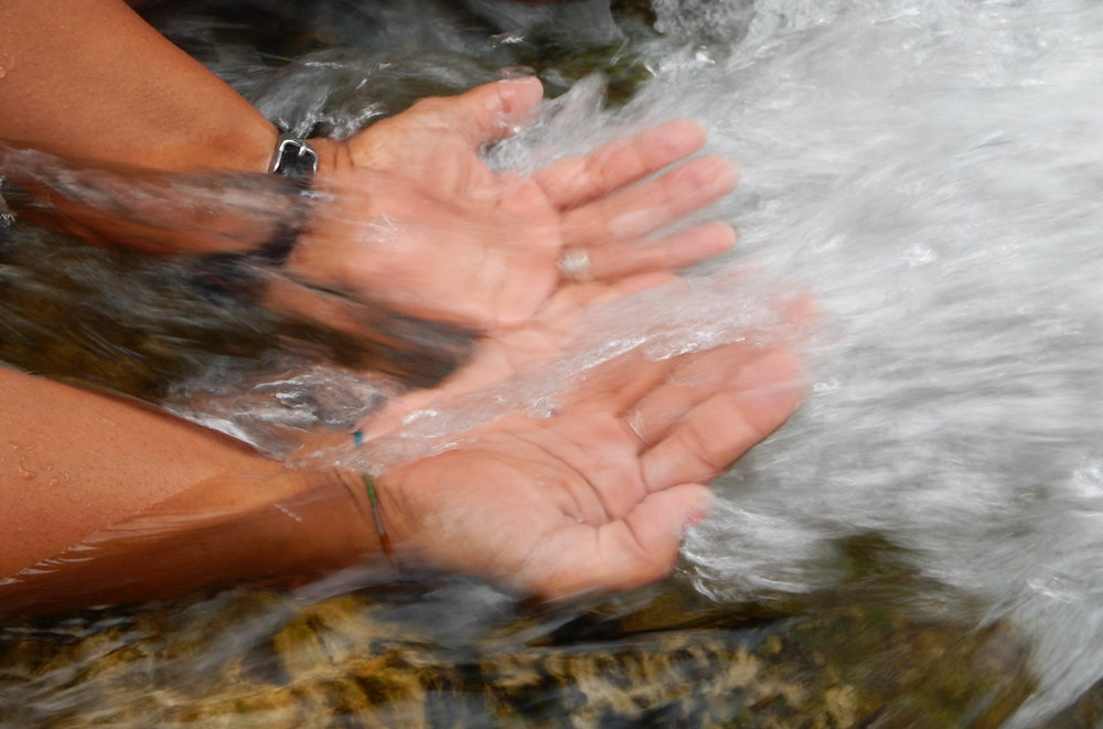 hands in waterfall.jpg
