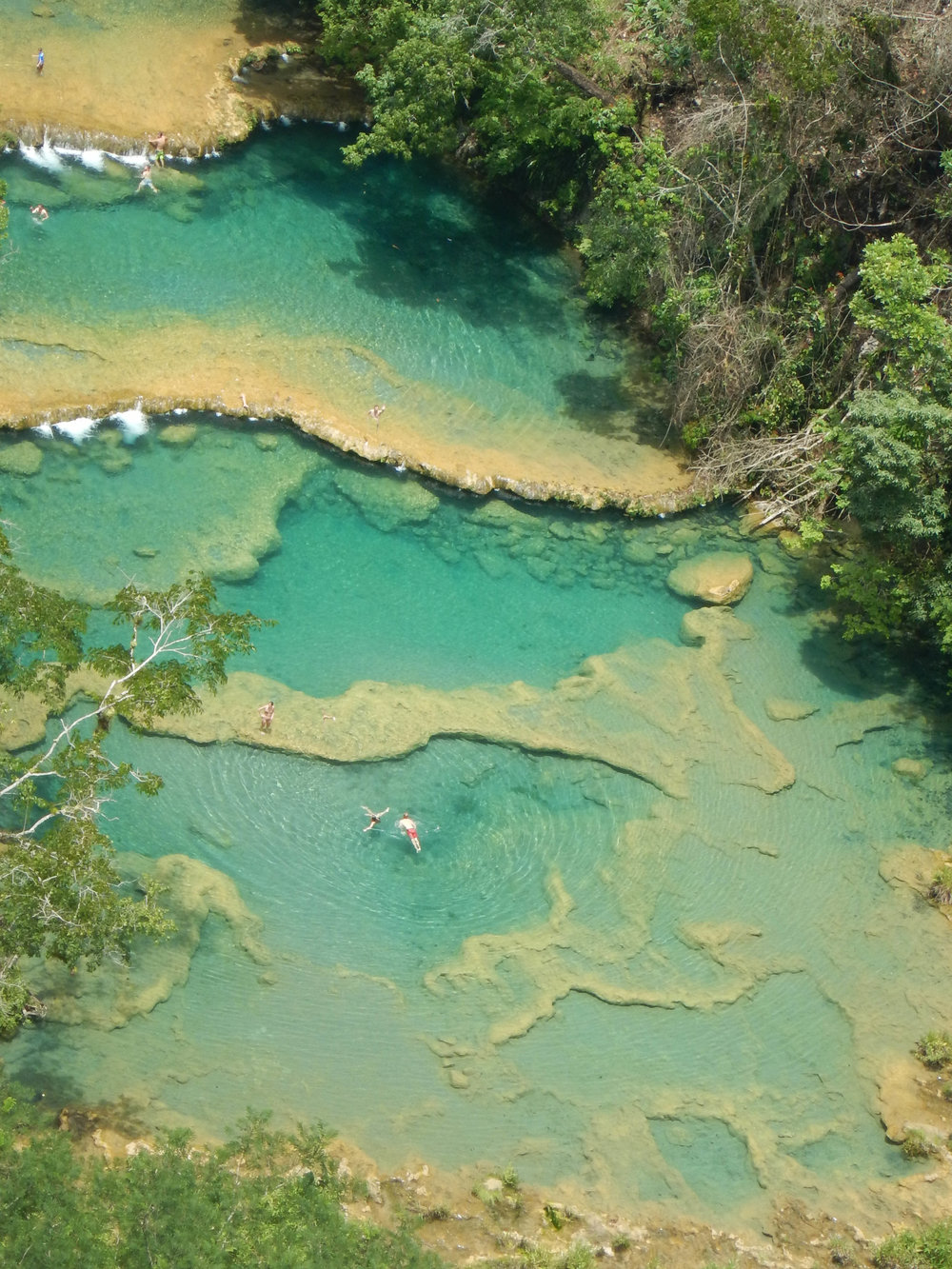 semuc champey with swimmers.jpg