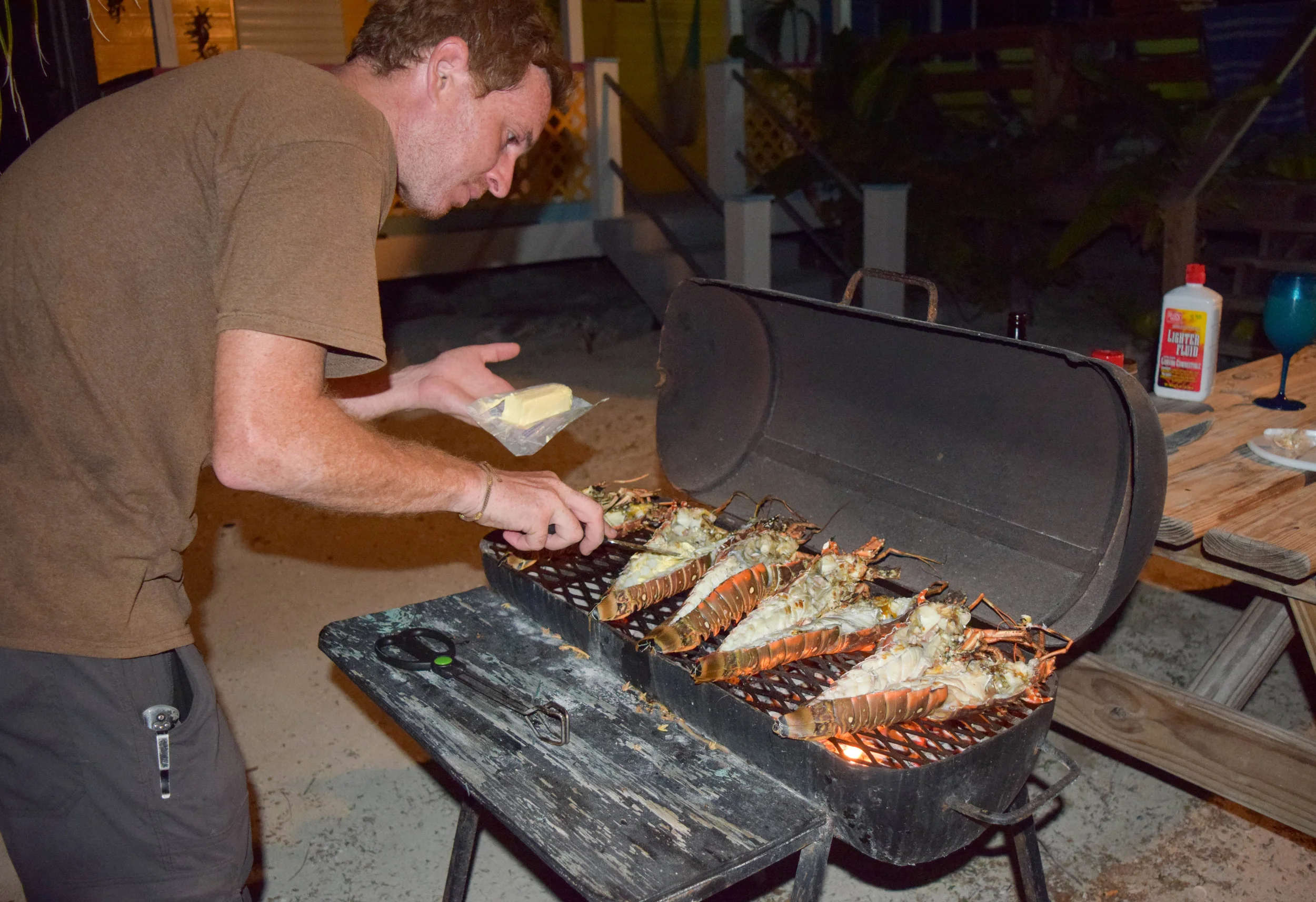 pete grilling lobster caye caulker.jpg