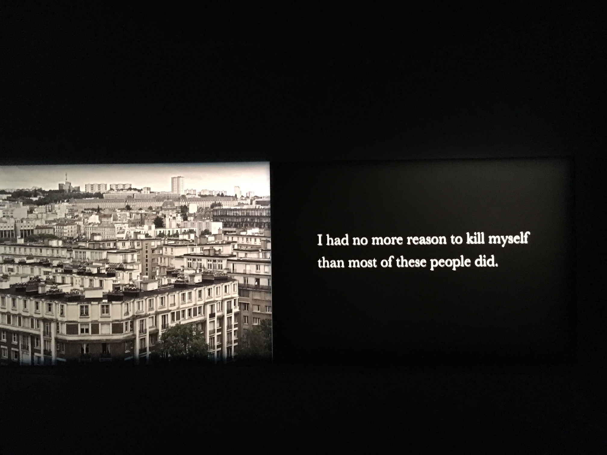 A phrase from Houellebecq’s 2015 novel, Submission: "I had no more reason to kill myself than most of these people did,” on the right panel of a large triptych at "Michel Houellebecq: French Bashing" art exhibit in New York. Photo Credit: Joel Whitney