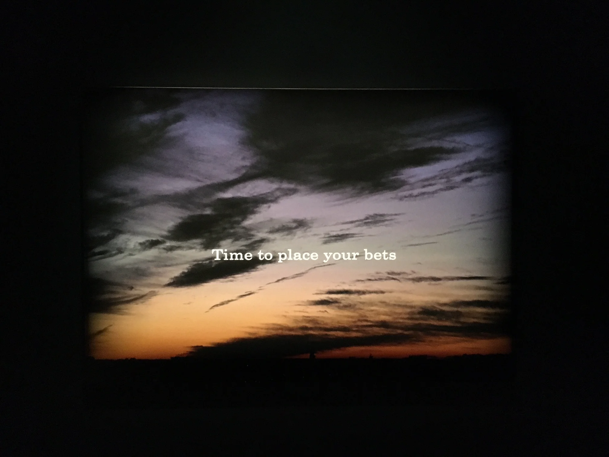 “It’s time to place your bets,” a quotation from Houellebecq’s poem “The Memory of the Sea.” It's one of the first images visitors see upon entry. Photo Credit: Joel Whitney