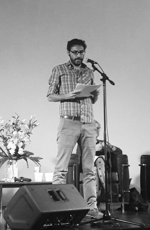 Poet Mariano Rolando Andrade reciting his poem "Escape a Nashville" on stage at the FIP International Festival of Poetry of Buenos Aires (June 14-18, 2017). Photo credit: Soledad Nieto