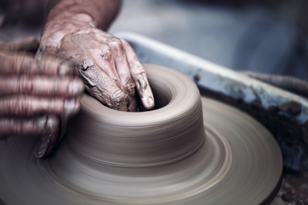 elderly hands spinning potter