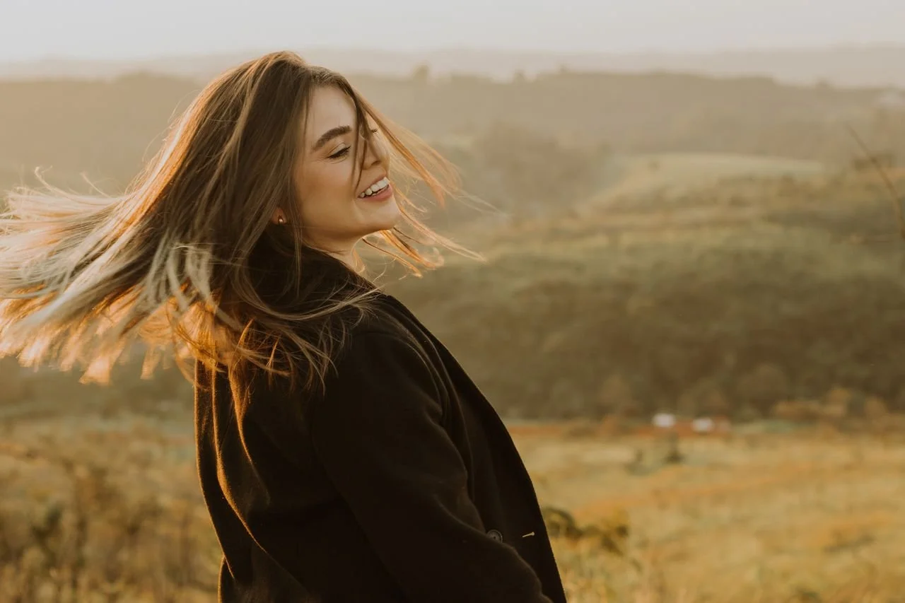 smiling-woman-in-black-coat