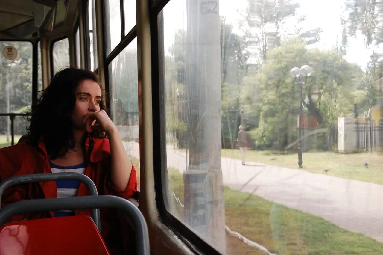 A thoughtful woman gazes out the window
