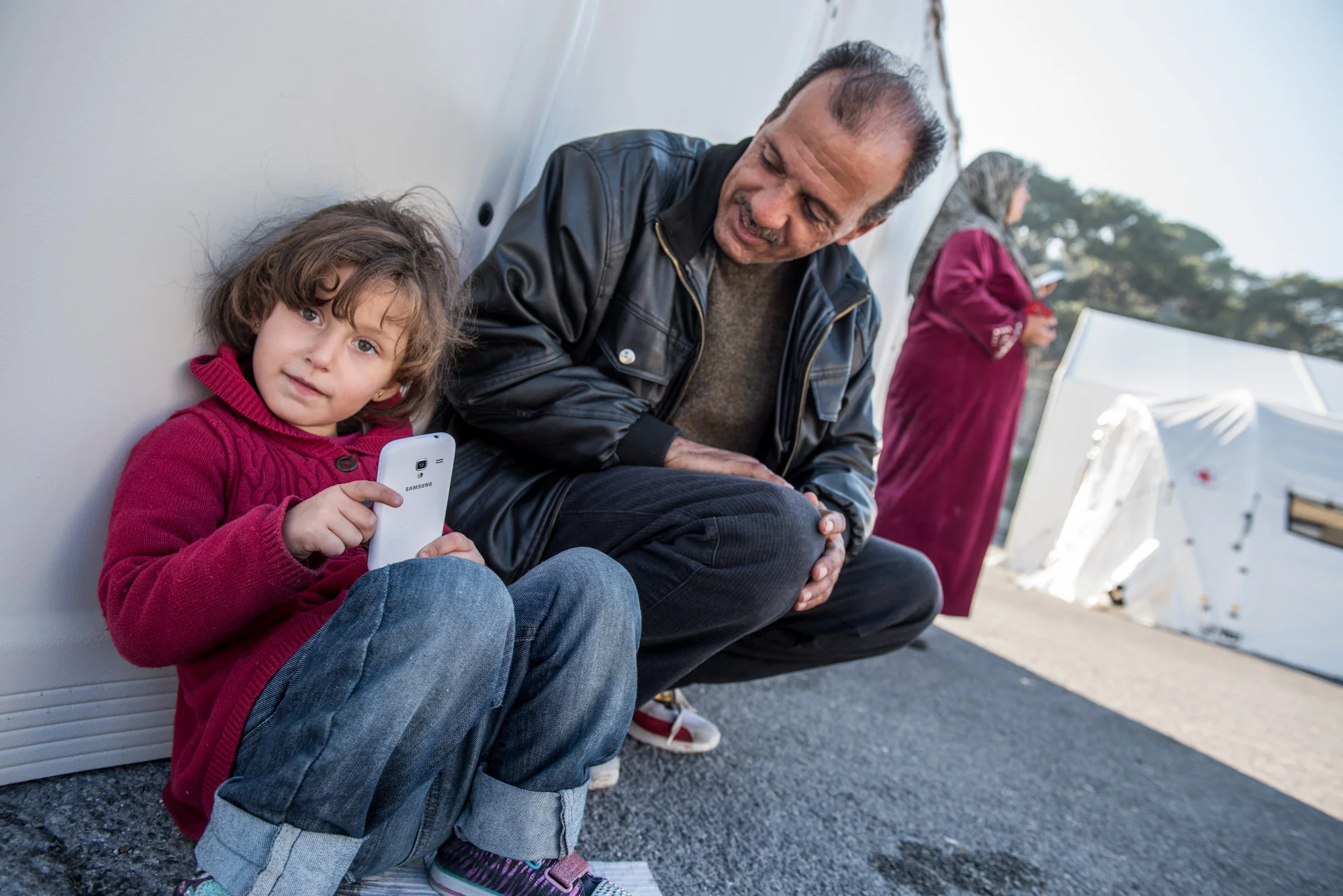 Syrian refugees connecting with family and information