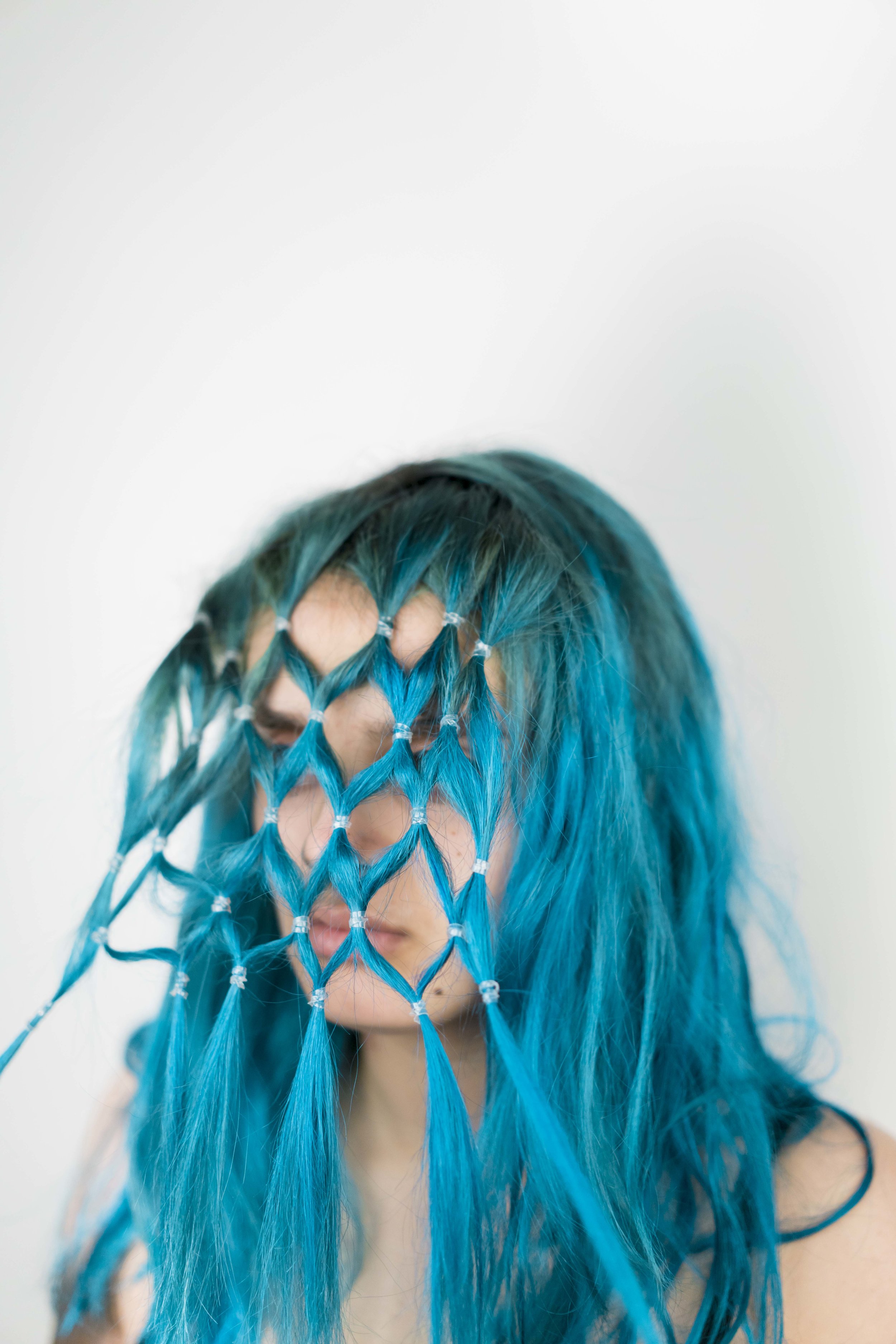 Blue <p> That’s what my hair bleeds <p> When I rinse you off me <p> Identical to a field of weeds <p> Tangled and knotted