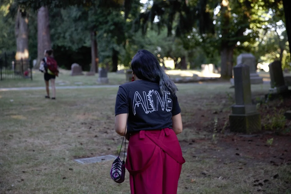 black unisex tee shirt with "alive" and coffin graphic on back - dfrntpigeon
