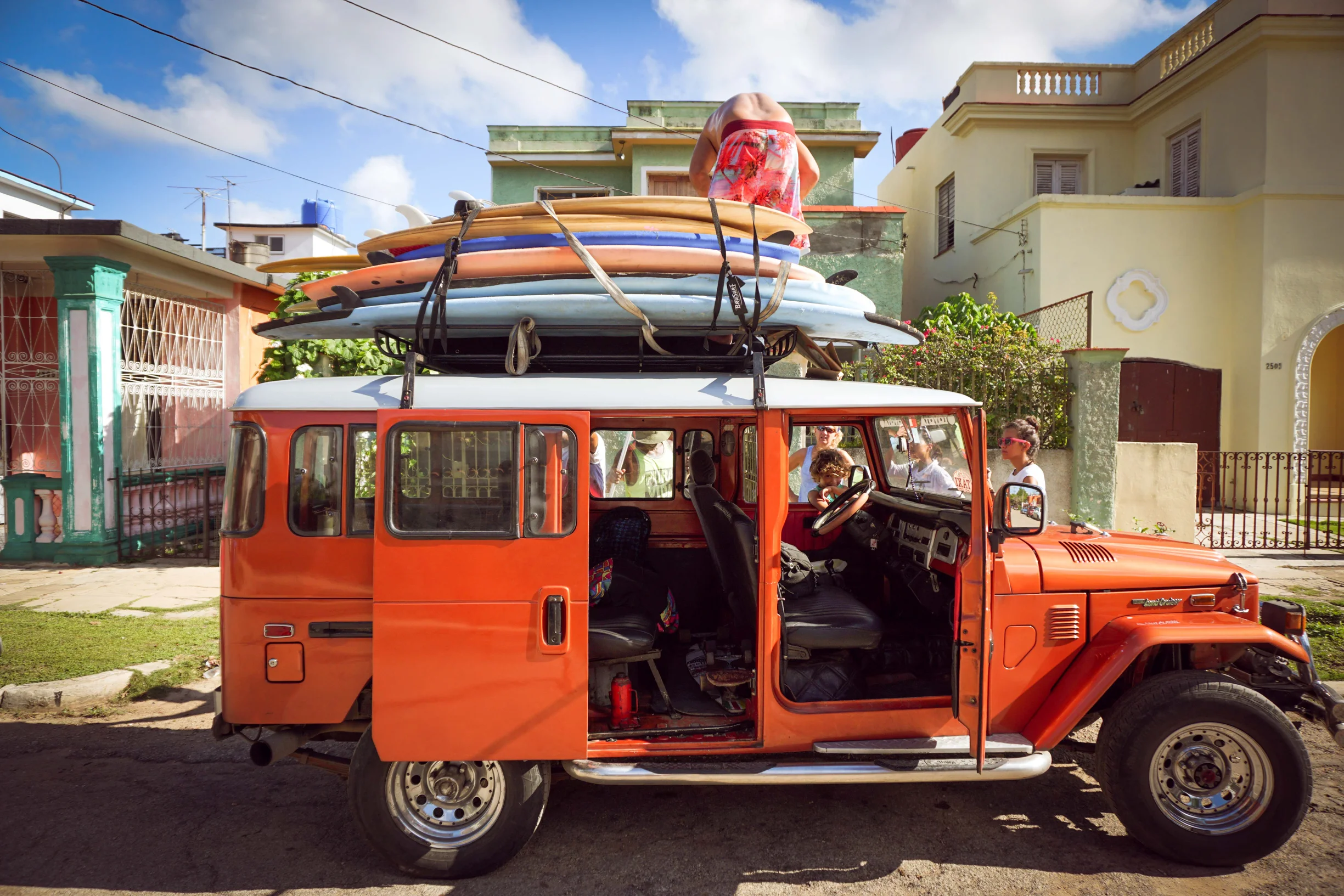 Our most excellent ride to Playa Megano - a sandy beach with beginner-friendly waves 45 minutes outside of Havana. Transportation to these beaches is a big challenge for our Wahines because taxis can be expensive and bus drivers will not allow the oversized boards on their overcrowded buses. Thanks to a private donor, 10 Wahines and surfboards made it to the beach!