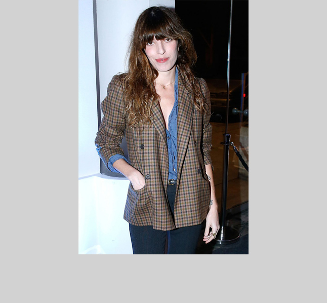 Birkin’s daughter Lou Douillon channels her maman, adding a little edge with a mens-y double-breasted plaid jacket over a chambray shirt and high-waisted black jeans.