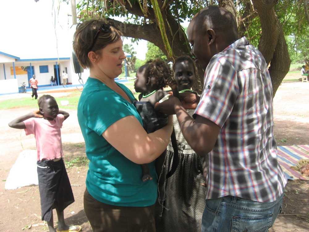 Sonya weighing a child in a nutrition program in South Sudan.