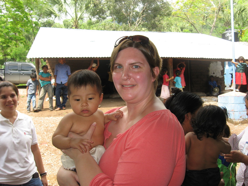 Sonya holding a child recovering from malnutrition in Guatemala.