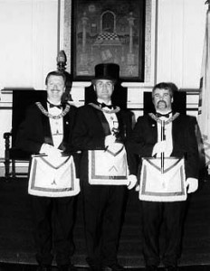 Wor. Rev. Henry I. Peirce as Master in 1999; to his right is Wor. Andrew R. Grove – Senior Warden, and right Bro. Adam Souza