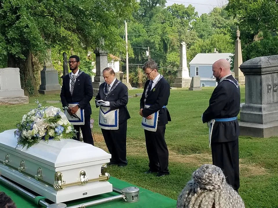 Devo Daves N V and R graveside.jpg