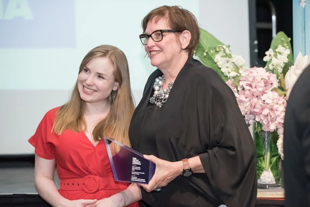 WHITELEY's co-producer Peta Ayers (L) and producer Sue Clothier (R) with the Film Critics' Circle of Australia 'Best Feature Documentary' statuette. Photo C/- the FCCA .