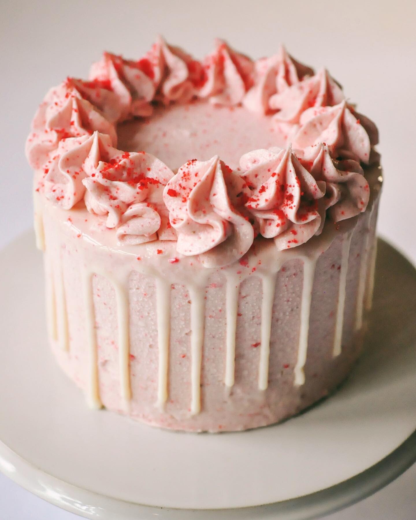 Our brand new Strawberry Cake is *so much* strawberry goodness. Three layers of sweet strawberry cake, fresh strawberries between the layers, strawberry icing all around, and &ndash; wait for it &ndash; even MORE strawberries on top (the pretty powde