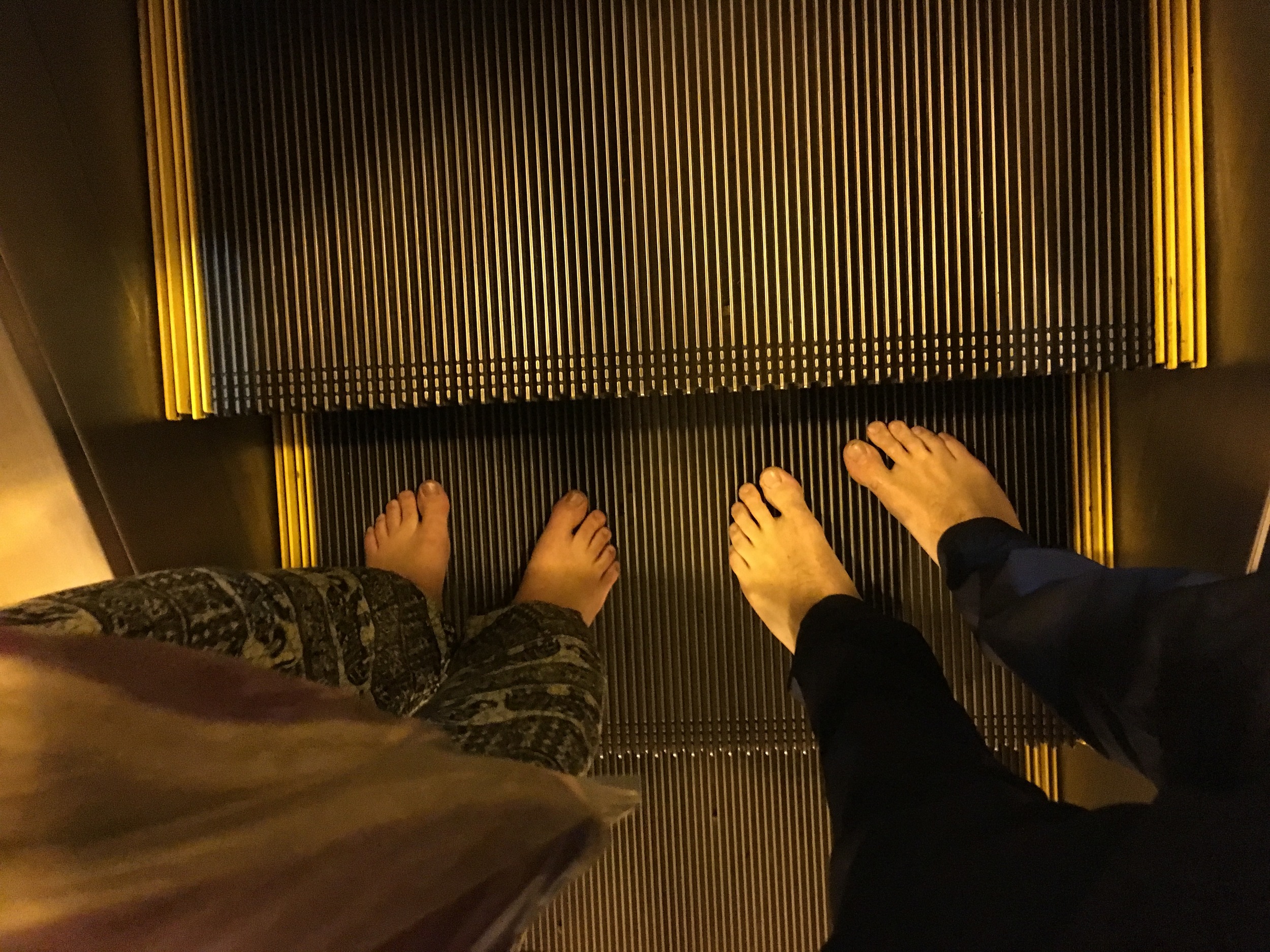 Shoe- and sock-less on the escalator!