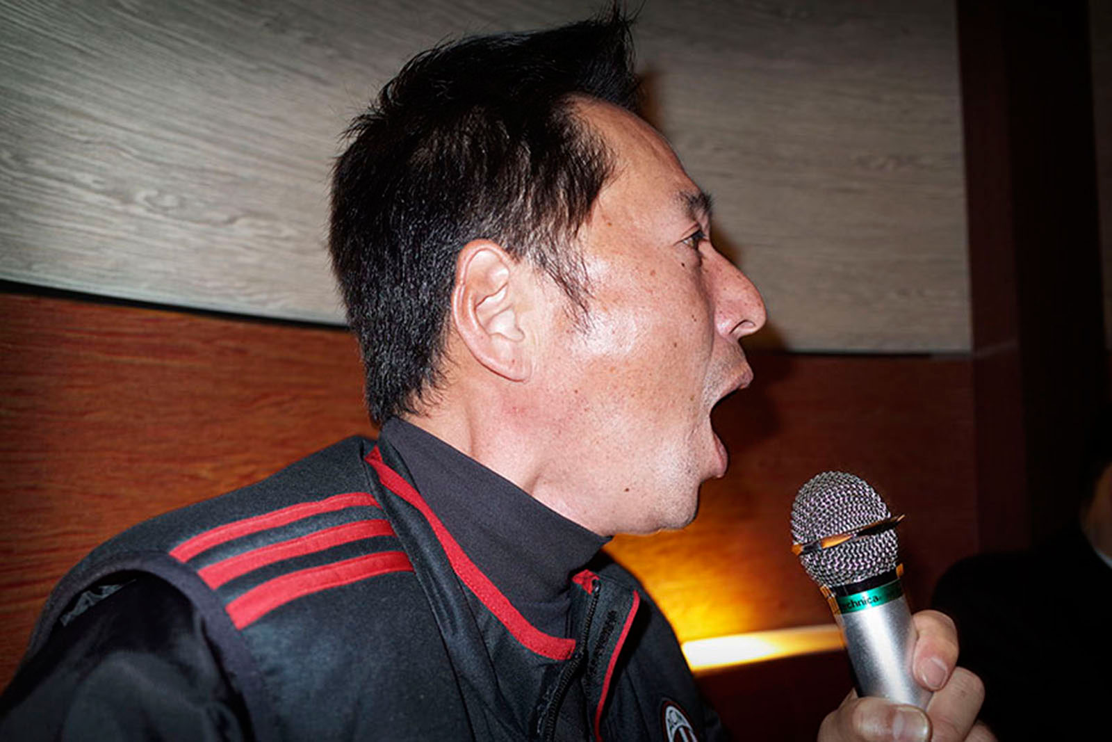   A man singing karaoke Sasebo, Japan 2015        