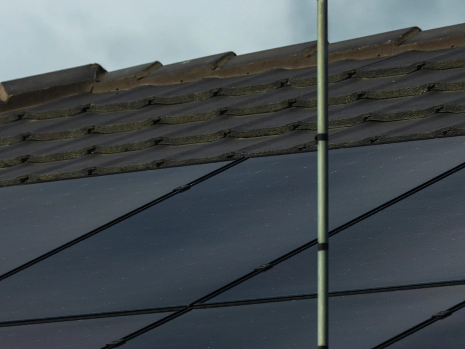 solar-panels-tiled-roof-tv-antenna-stock.jpg