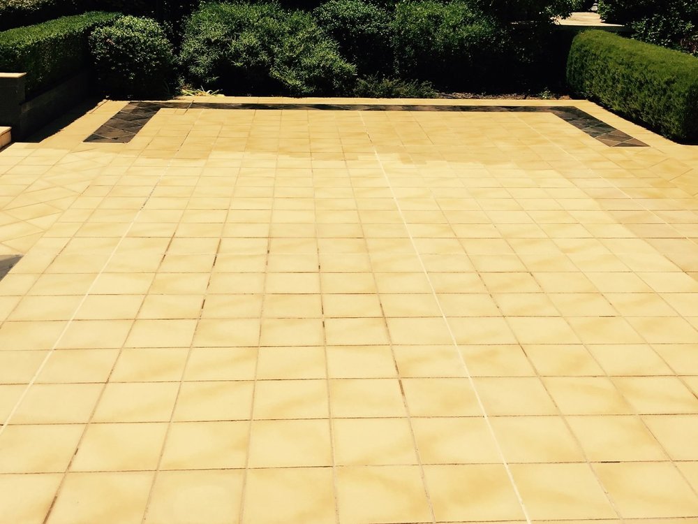 Close-up of the tiled patio part-way through sealing (Canberra)