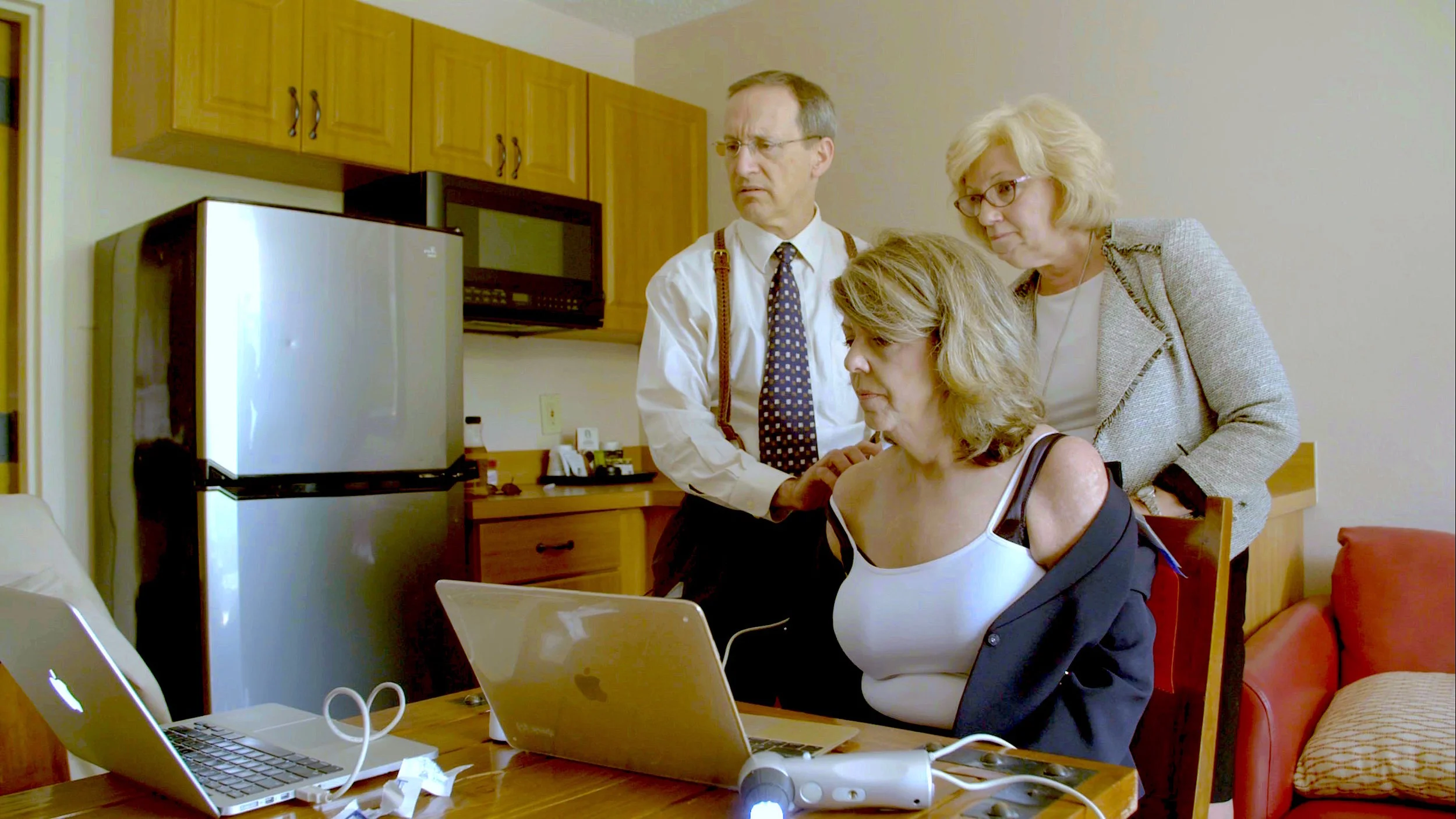 Dermatologist Steven Feldman examines CIndy Casey-Holdman’s skin in an effort to better understand and find possible reasons for the filaments and lesions on her skin