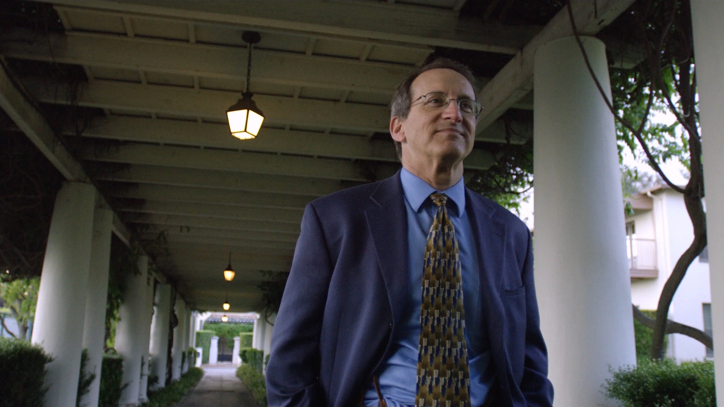 SKIN DEEP_Dr Steven Feldman walking collonades.jpg