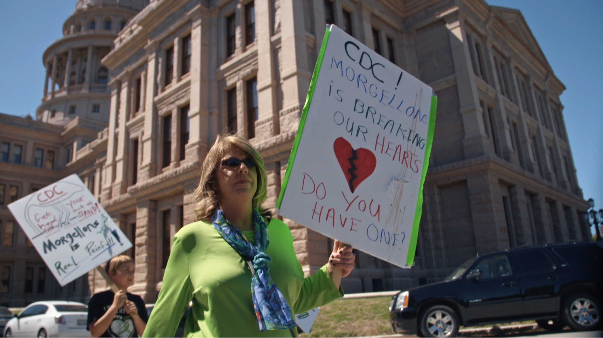  In the documentary film, “Skin Deep: The Battle Over Morgellons”, Cindy Casey-Holman and other activists protest at the Texas State Capital in an effort to bring awareness to the lack of medical treatment for Morgellons Disease patients. 