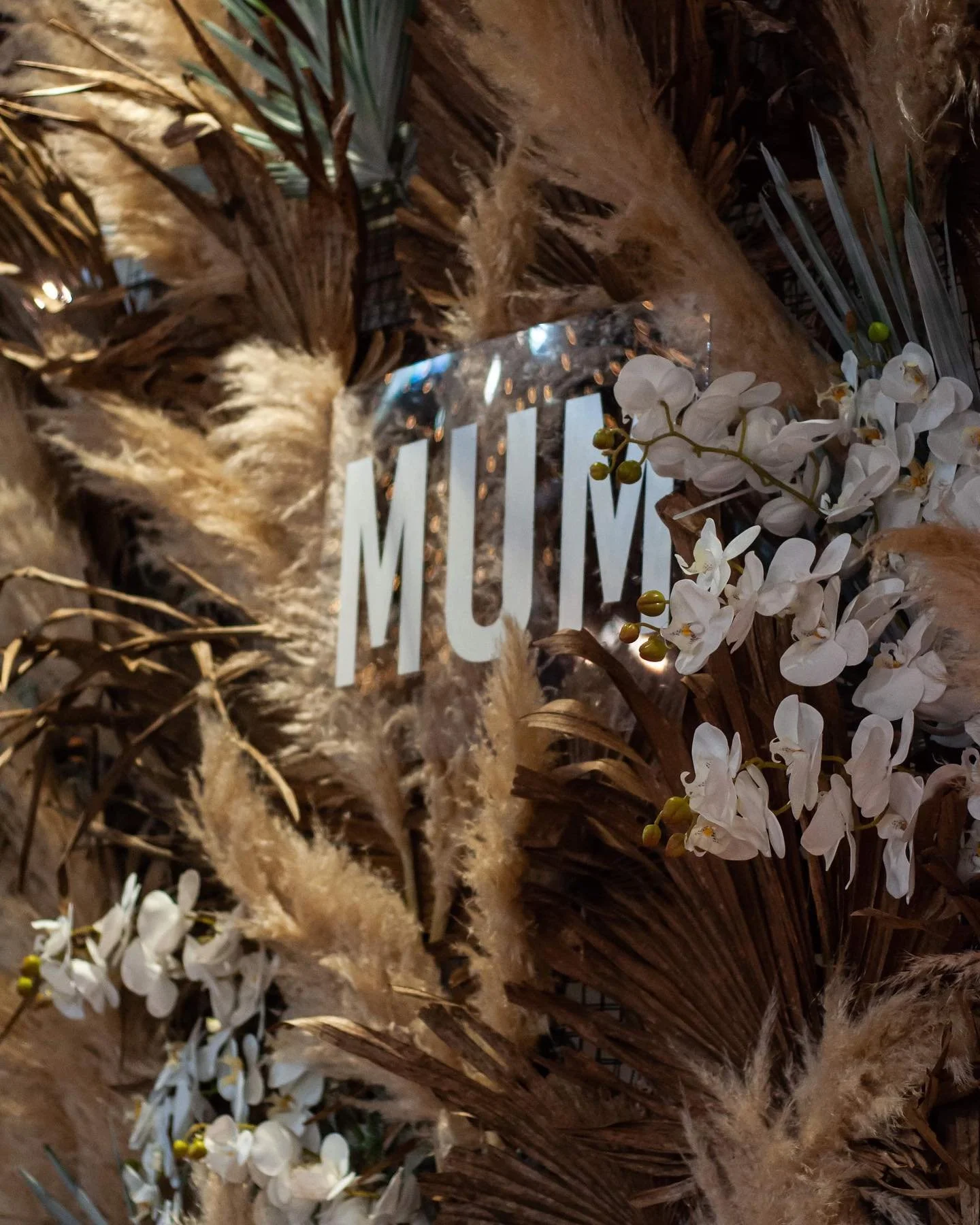 Sally Bay GLOW Mother's Day photo wall.jpeg