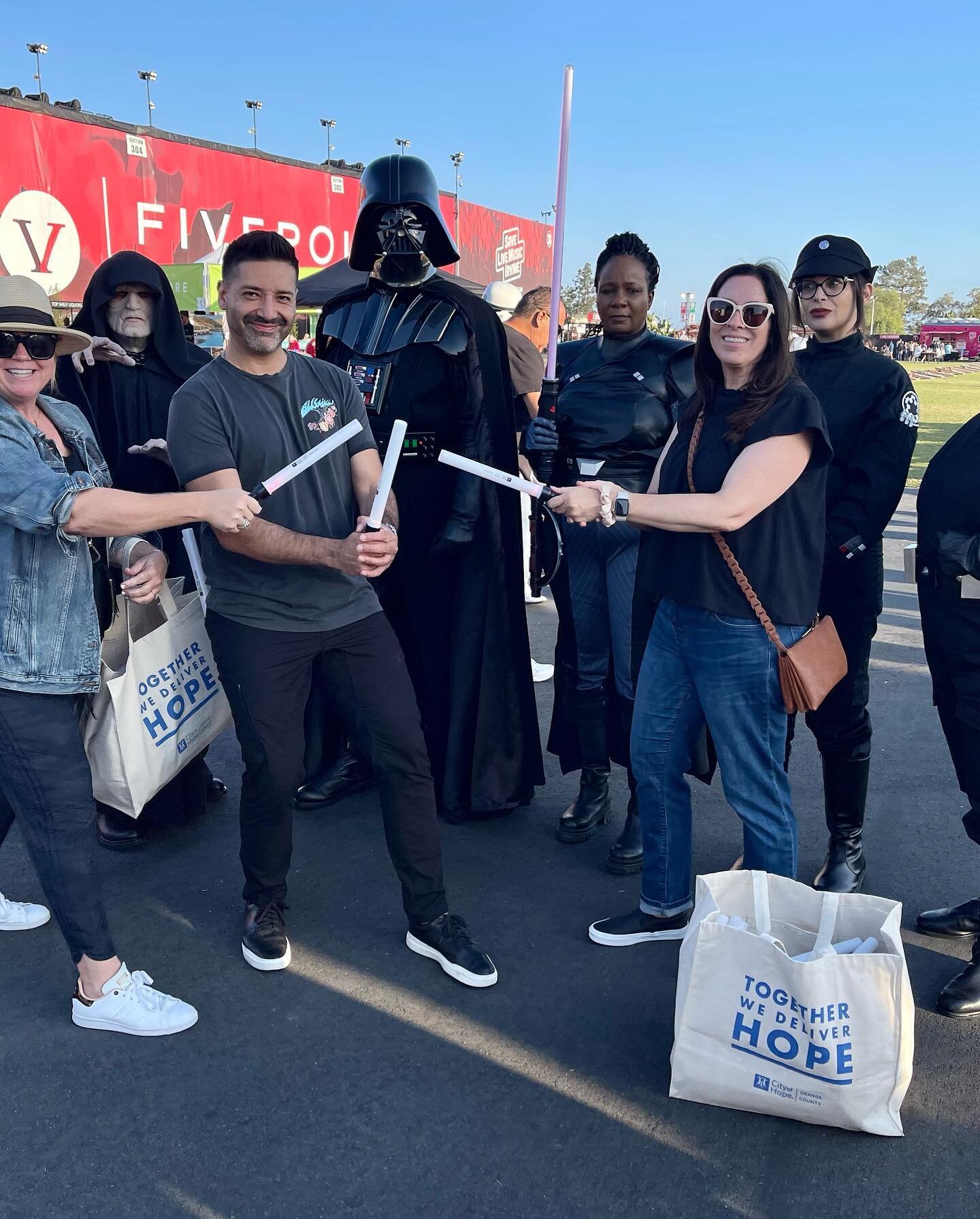 Fun night with the fam at PSO&rsquo;s presentation of Empire Strikes Back! All for a good cause - handed out 5000 City of Hope OC light sabers! May the HOPE be with you! 💙