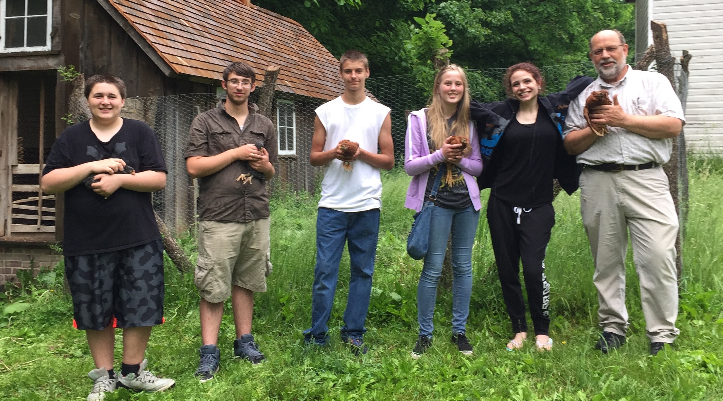 Westville students and teacher Bill Smith, happy to see the chicks they raised in class make a smooth transition to their new summer home.