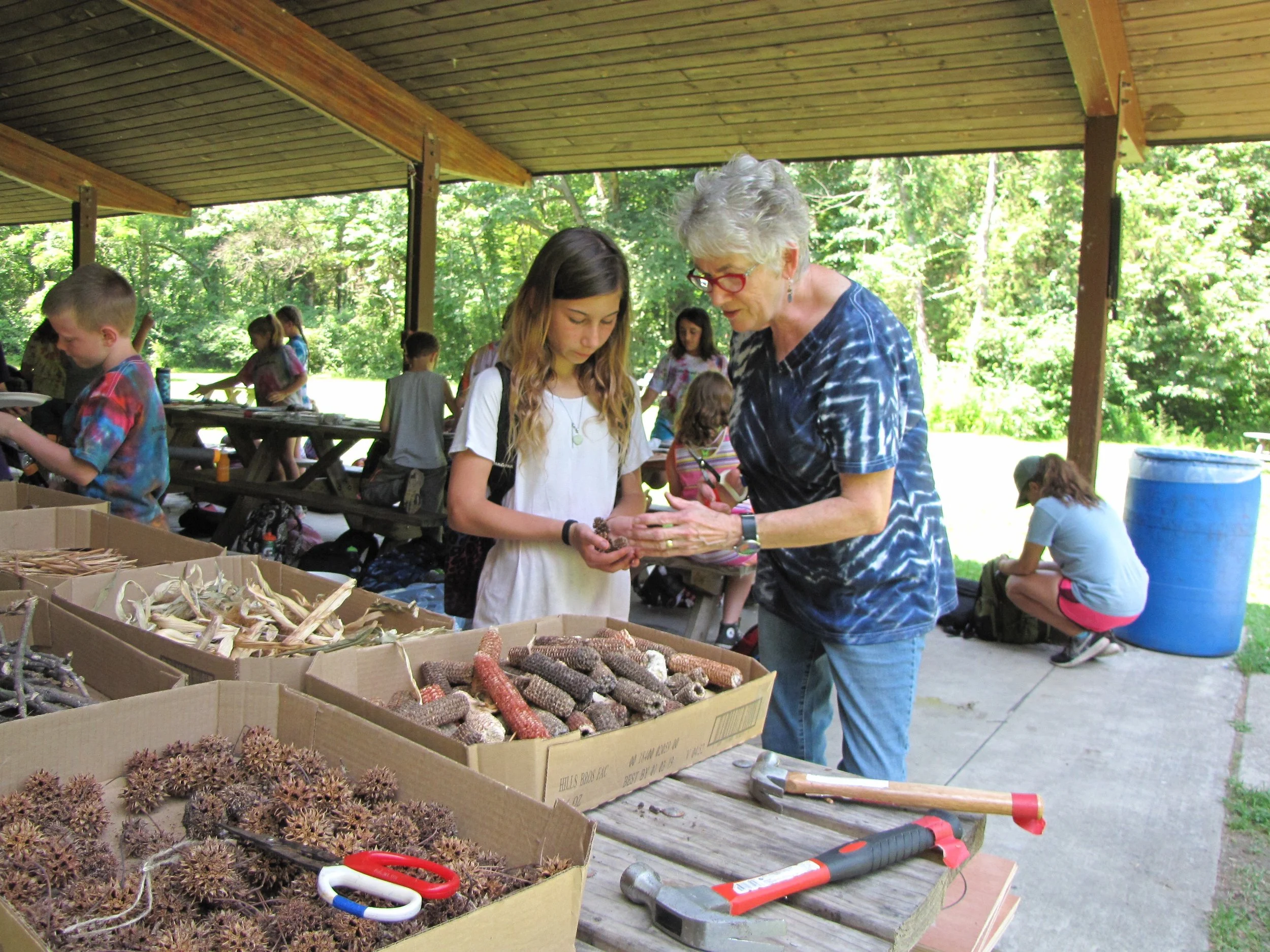 Zimmer consults with a camper as they consider material selection.