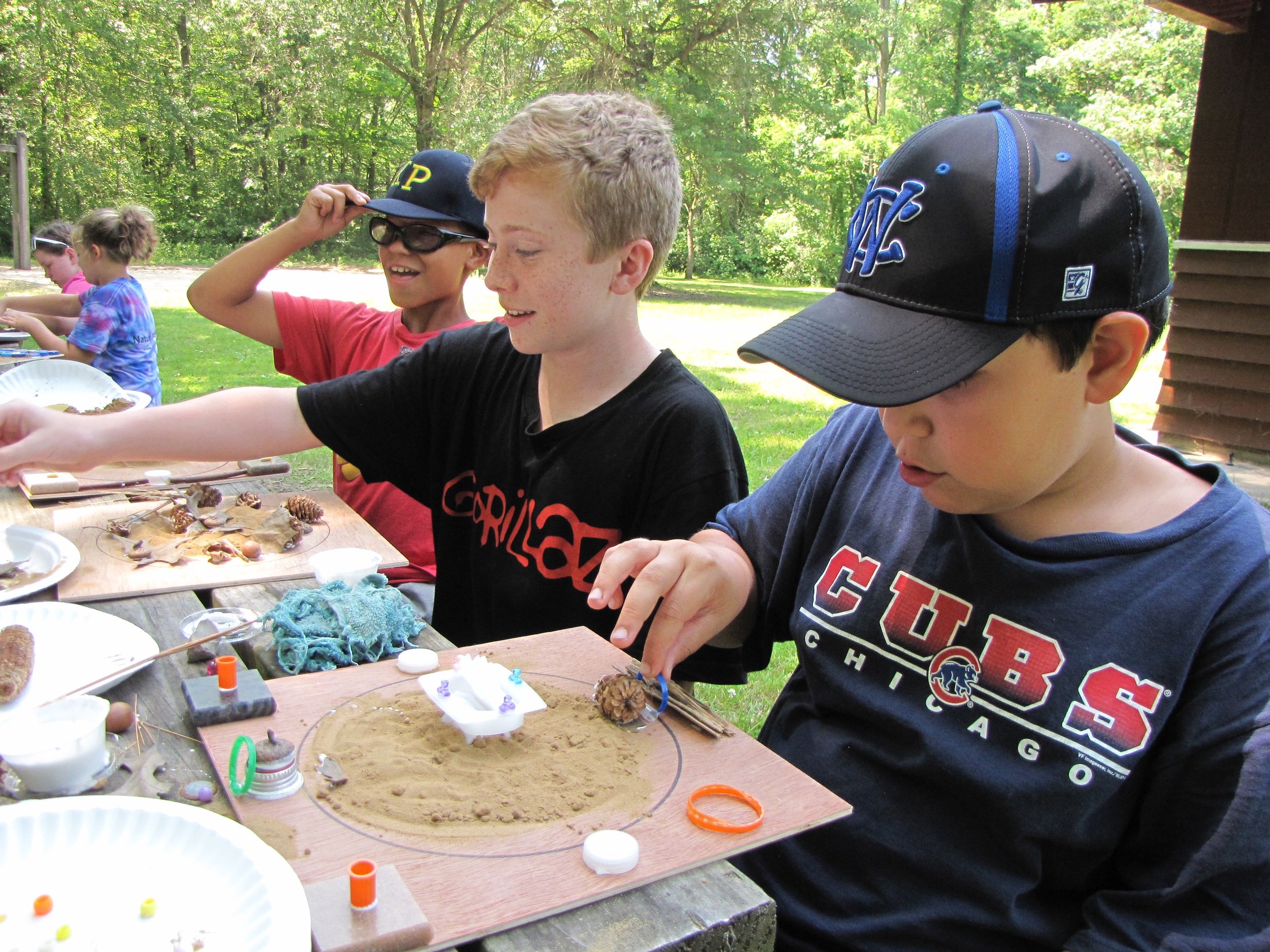 Campers share inspiration and suggestions while working "en plein air".