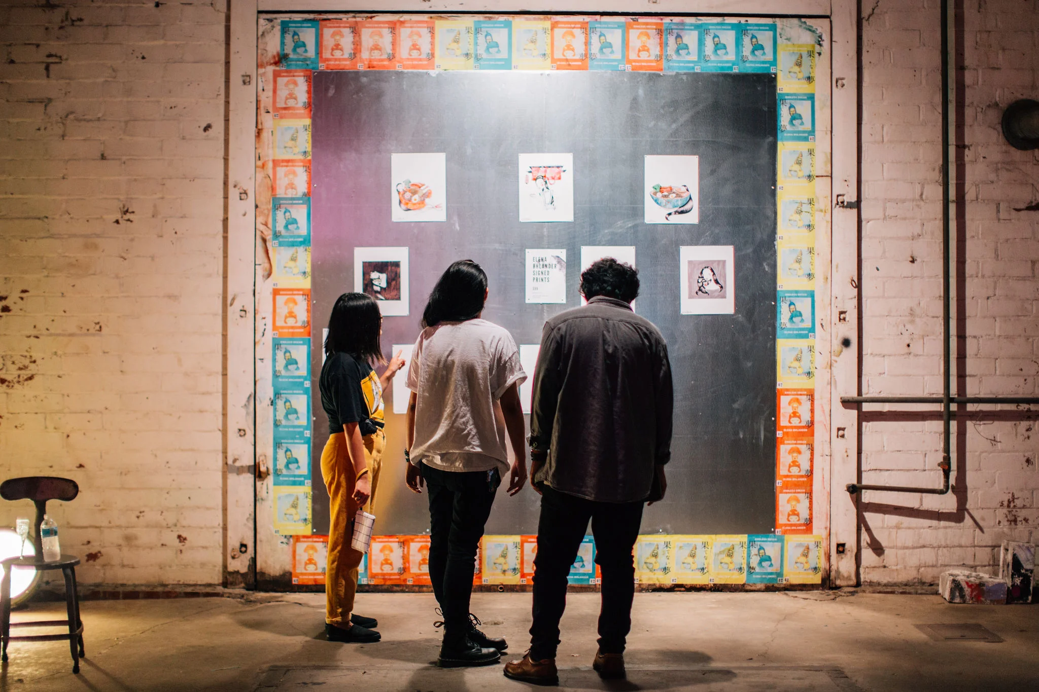 Wheat pasted, magnetic wall to display limited edition, signed prints for sale. Image Credit: Sindy Gonzalez of Verance Photography