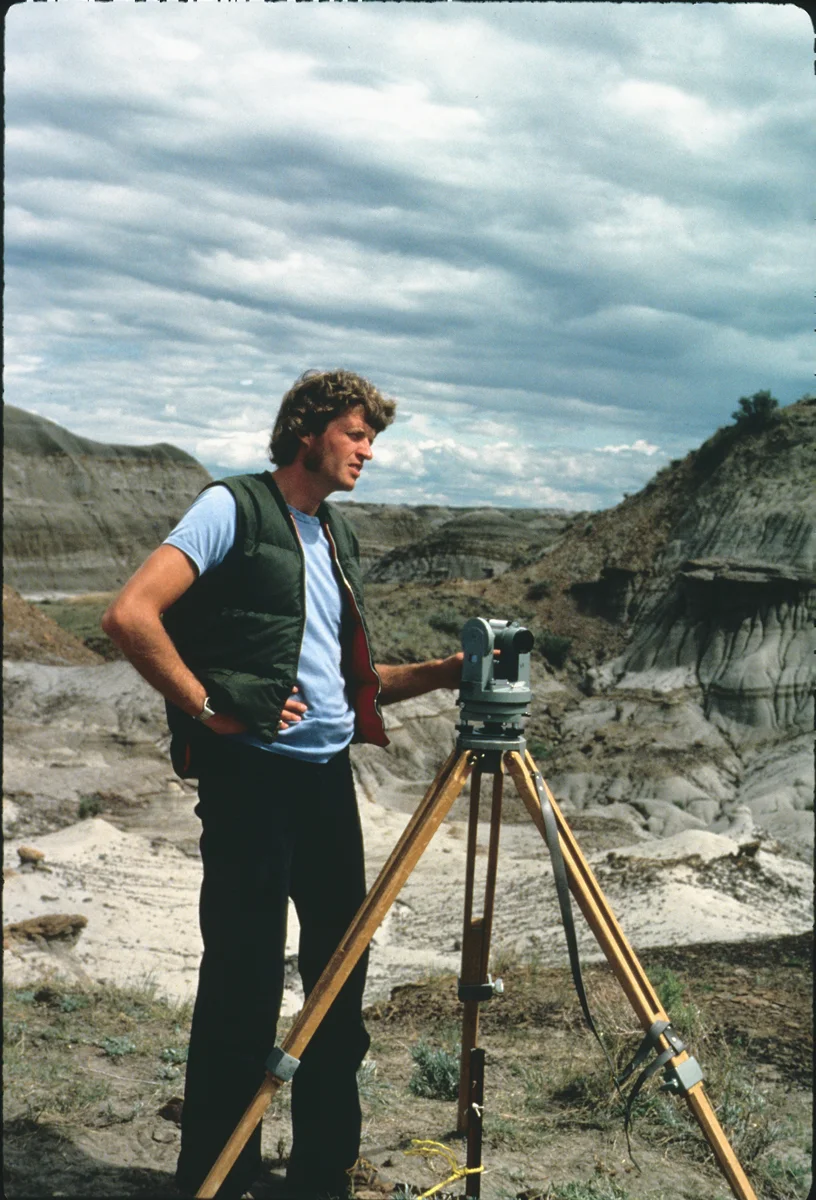 Phil Currie in the early 80’s using surveying equipment to map bonebeds.